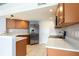 Bright kitchen featuring stainless steel appliances, ample cabinet space, and tile flooring at 337 Goldstone Pl, Lake Mary, FL 32746