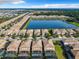 Community aerial view with lake, rows of homes, and beautiful Florida scenery at 8844 Corcovado Dr, Kissimmee, FL 34747