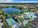 Overhead shot of community pool area featuring waterslides, lazy river, sports court and pool at 8844 Corcovado Dr, Kissimmee, FL 34747