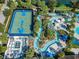 Aerial view of resort-style community amenities including basketball court and lazy river at 8844 Corcovado Dr, Kissimmee, FL 34747