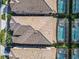 Aerial view of tile roofs and screened-in backyard pools at 8844 Corcovado Dr, Kissimmee, FL 34747
