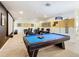 Spacious game room with a pool table and theater seating with a projector screen at 8844 Corcovado Dr, Kissimmee, FL 34747