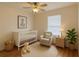 Charming Bedroom with a crib, rocking chair, and soft decor at 14460 Clarkson Dr, Orlando, FL 32828