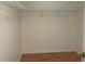 Walk-in closet with laminate wood flooring and shelving offering an organized storage space for your belongings at 14460 Clarkson Dr, Orlando, FL 32828