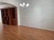 Bright dining room features chair rail and modern chandelier at 14460 Clarkson Dr, Orlando, FL 32828