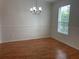 Dining room with window showing natural light and modern chandelier at 14460 Clarkson Dr, Orlando, FL 32828