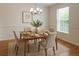 Staged dining room with modern table and chairs with natural light at 14460 Clarkson Dr, Orlando, FL 32828