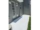 Outdoor patio with door access and green foliage nearby at 14460 Clarkson Dr, Orlando, FL 32828