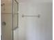 Walk-in shower featuring glass doors and contemporary fixtures at 14460 Clarkson Dr, Orlando, FL 32828