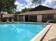 Sparkling community pool with adjacent building at 2309 Sun Valley Cir, Winter Park, FL 32792