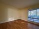 Bedroom with wood floor, sunny window, and neutral wall color at 2432 Lemon Tree Ln # B, Orlando, FL 32839