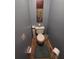 Small half bathroom with toilet and decorative art at 6147 Sunnyvale Dr, Orlando, FL 32822