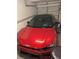 Garage with red Kia EV6 at 6147 Sunnyvale Dr, Orlando, FL 32822