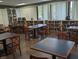 Community library with tables and chairs, well-stocked bookshelves at 6147 Sunnyvale Dr, Orlando, FL 32822