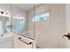 Shower in the bathroom is glass enclosed with subway tile and has a bench and shampoo niche at 10257 Medawar St, Orlando, FL 32827