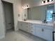 Spa-like bathroom with double vanity and marble flooring at 10257 Medawar St, Orlando, FL 32827