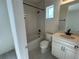 Clean bathroom with a bathtub, shower, and modern vanity at 10257 Medawar St, Orlando, FL 32827