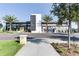 Front view of Canvas Restaurant & Market, a modern building with palm trees and landscaping at 10257 Medawar St, Orlando, FL 32827