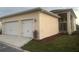 Two-car garage with landscaping and a spacious driveway at 10257 Medawar St, Orlando, FL 32827