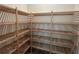 Spacious pantry with ample wooden shelving for storage at 10257 Medawar St, Orlando, FL 32827