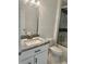 Bright bathroom with updated vanity, granite countertop and shower with modern sliding doors at 17271 E Peggy Ave. Ave, Mount Dora, FL 32757