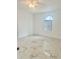 Spacious bedroom with marble floors, neutral walls, and a large window at 17271 E Peggy Ave. Ave, Mount Dora, FL 32757