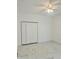 Spacious bedroom featuring a ceiling fan, tile floors and a generously sized closet at 17271 E Peggy Ave. Ave, Mount Dora, FL 32757