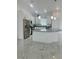 Modern kitchen with stainless steel appliances, a gray granite countertop island, and white cabinetry at 17271 E Peggy Ave. Ave, Mount Dora, FL 32757