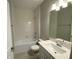 Clean bathroom with white vanity, bathtub, and tile flooring at 2463 Francisco Art Ct, Oviedo, FL 32765