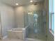 Spa-like bathroom with soaking tub and walk-in shower at 2463 Francisco Art Ct, Oviedo, FL 32765