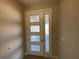 Modern entry door with glass panels welcomes you into this home at 2463 Francisco Art Ct, Oviedo, FL 32765