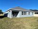 Single-story home with covered patio and gray exterior at 2463 Francisco Art Ct, Oviedo, FL 32765