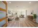 Bright open-concept living area with hardwood floors flows into dining area and kitchen for easy entertaining at 4058 Sw 167Th St, Ocala, FL 34473