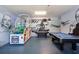 A fully equipped game room with vibrant decor, a pool table, and a basketball arcade game at 7554 Marker Ave, Kissimmee, FL 34747