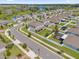 Aerial view showing a community of houses near a lake at 1116 Hendon Loop, Davenport, FL 33837