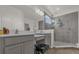 Elegant bathroom with double vanity, large shower, and modern fixtures at 1116 Hendon Loop, Davenport, FL 33837