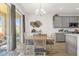 Kitchen and dining area with gray cabinets and wood flooring at 1116 Hendon Loop, Davenport, FL 33837