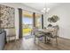 Light-filled dining area with sliding doors leading to the backyard at 1116 Hendon Loop, Davenport, FL 33837