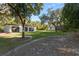 Large backyard with detached garage and lush landscaping at 17577 Davenport Rd, Winter Garden, FL 34787