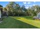 Expansive grassy backyard with mature trees and privacy at 17577 Davenport Rd, Winter Garden, FL 34787