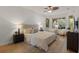 Spacious bedroom with a comfortable bed and large window at 17577 Davenport Rd, Winter Garden, FL 34787