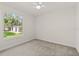 Simple bedroom with large window and backyard view at 17577 Davenport Rd, Winter Garden, FL 34787