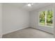 Simple bedroom with ceiling fan and window at 17577 Davenport Rd, Winter Garden, FL 34787