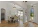 Bright dining room with a wood table and neutral decor at 17577 Davenport Rd, Winter Garden, FL 34787