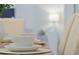 Close-up of a table setting in a bright dining room at 17577 Davenport Rd, Winter Garden, FL 34787