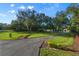 Long driveway with manicured landscaping leading to the home entrance at 17577 Davenport Rd, Winter Garden, FL 34787