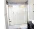 Bright bathroom featuring a shower with glass doors and modern fixtures at 2649 Crown Ct # 2649, Kissimmee, FL 34741