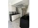 A view of the kitchen with white cabinets and modern appliances at 2649 Crown Ct # 2649, Kissimmee, FL 34741