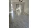 Bright living room with ceiling fan and sliding glass doors to the outdoors at 2649 Crown Ct # 2649, Kissimmee, FL 34741