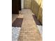 Brick walkway with decorative rock feature leads to the home's entrance at 2649 Crown Ct # 2649, Kissimmee, FL 34741